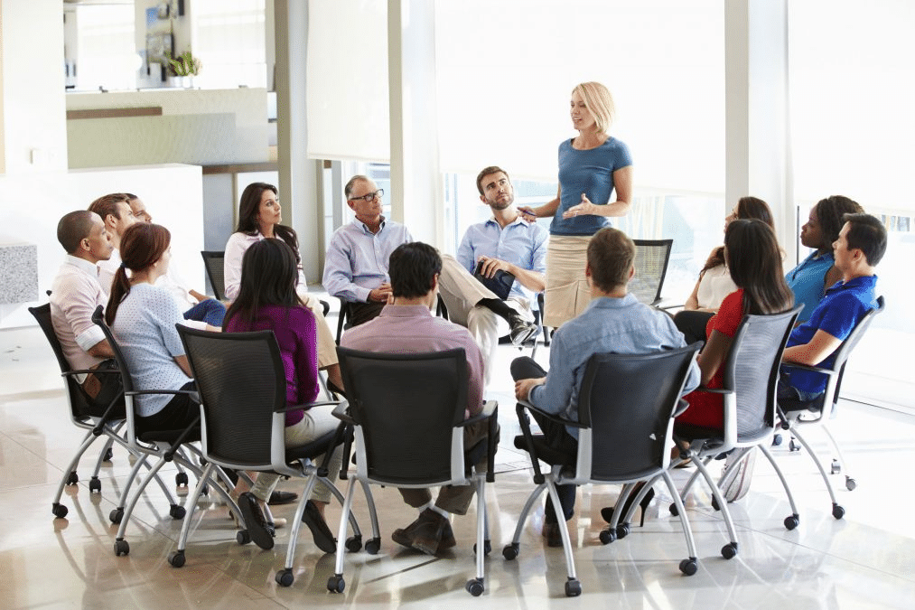 a business owner holding a meeting with her team