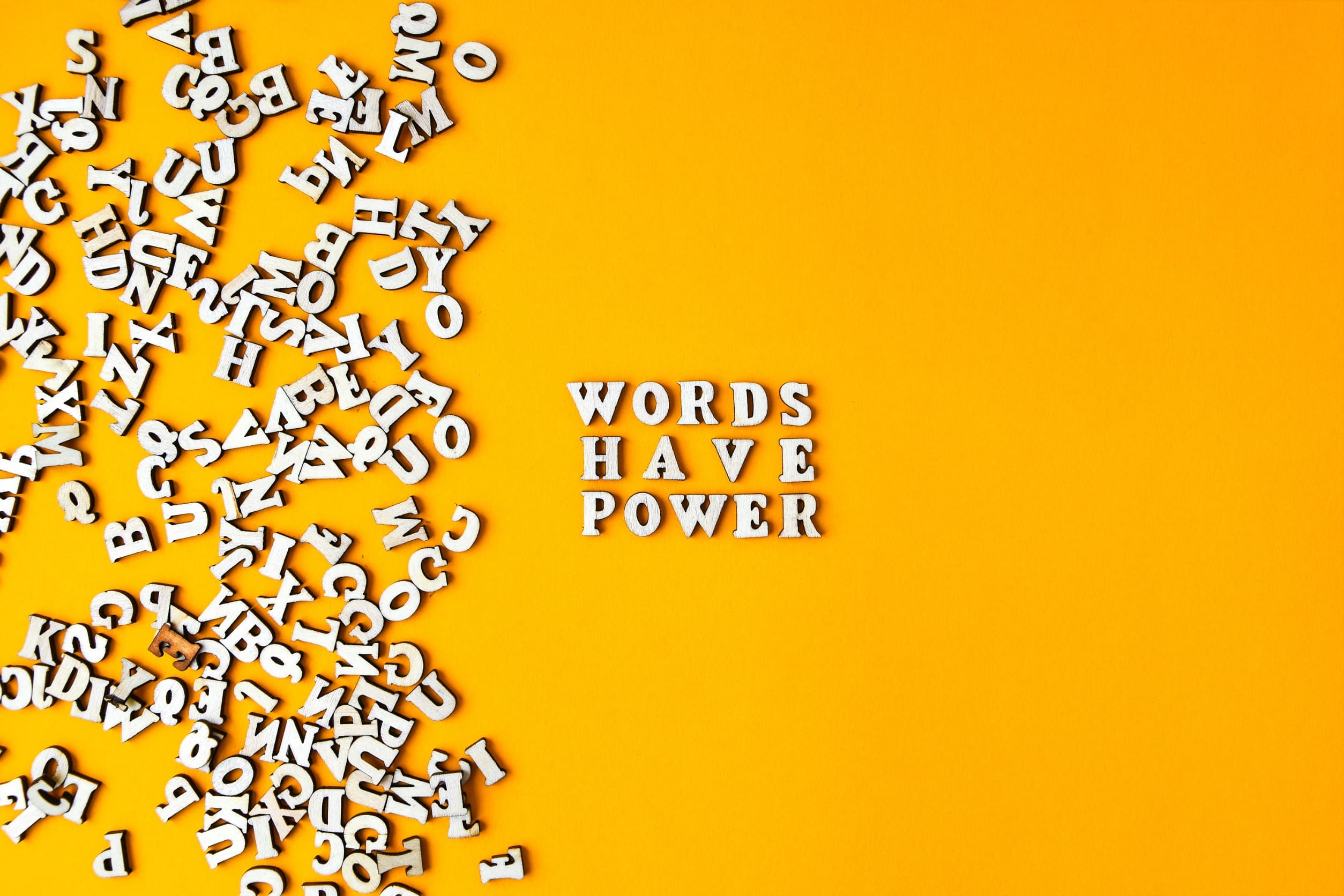 letters on a yellow background that spell out the phrase words have power